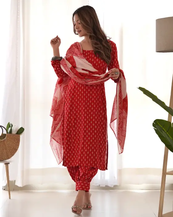 RED HAND BLOCK PRINTED SALWAR SUIT SET . THIS SET IS HAVING ROUND NECK AND COMES ALONG WITH AFGHANI SALWAR PAIRED WITH MULMAL COTTON DUPATTA.The colors seen in the image may vary from the actual product due to different computer screen resolutions and dis